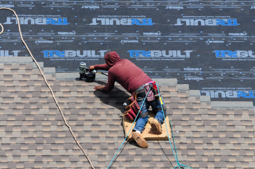 Roofing underlayment installation.