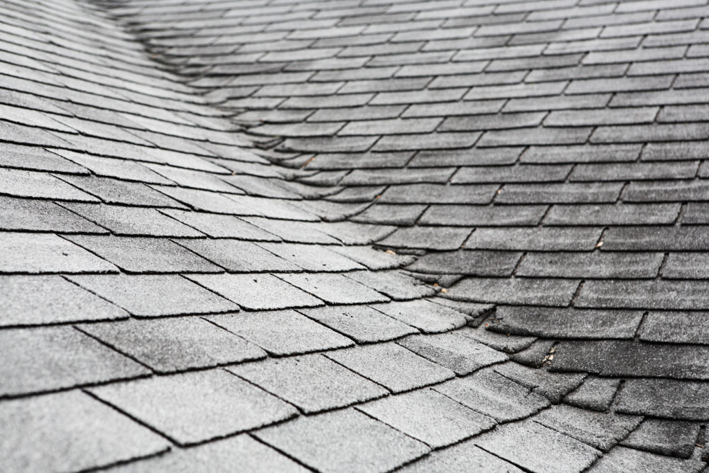 image of old asphalt shingles on house