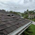 Weathered roof on a Brandon, Florida home showing storm damage from lifted shingles and granule loss — a common sight in Hillsborough County after Hurricane Milton