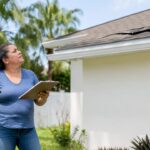 Florida homeowner inspecting roof storm damage