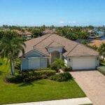 Vacant Florida home with hurricane shutters closed in a Tampa Bay neighborhood during summer hurricane season