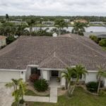 Aging asphalt shingle roof on a Tampa Bay Florida home showing granule loss and wear in humid subtropical climate